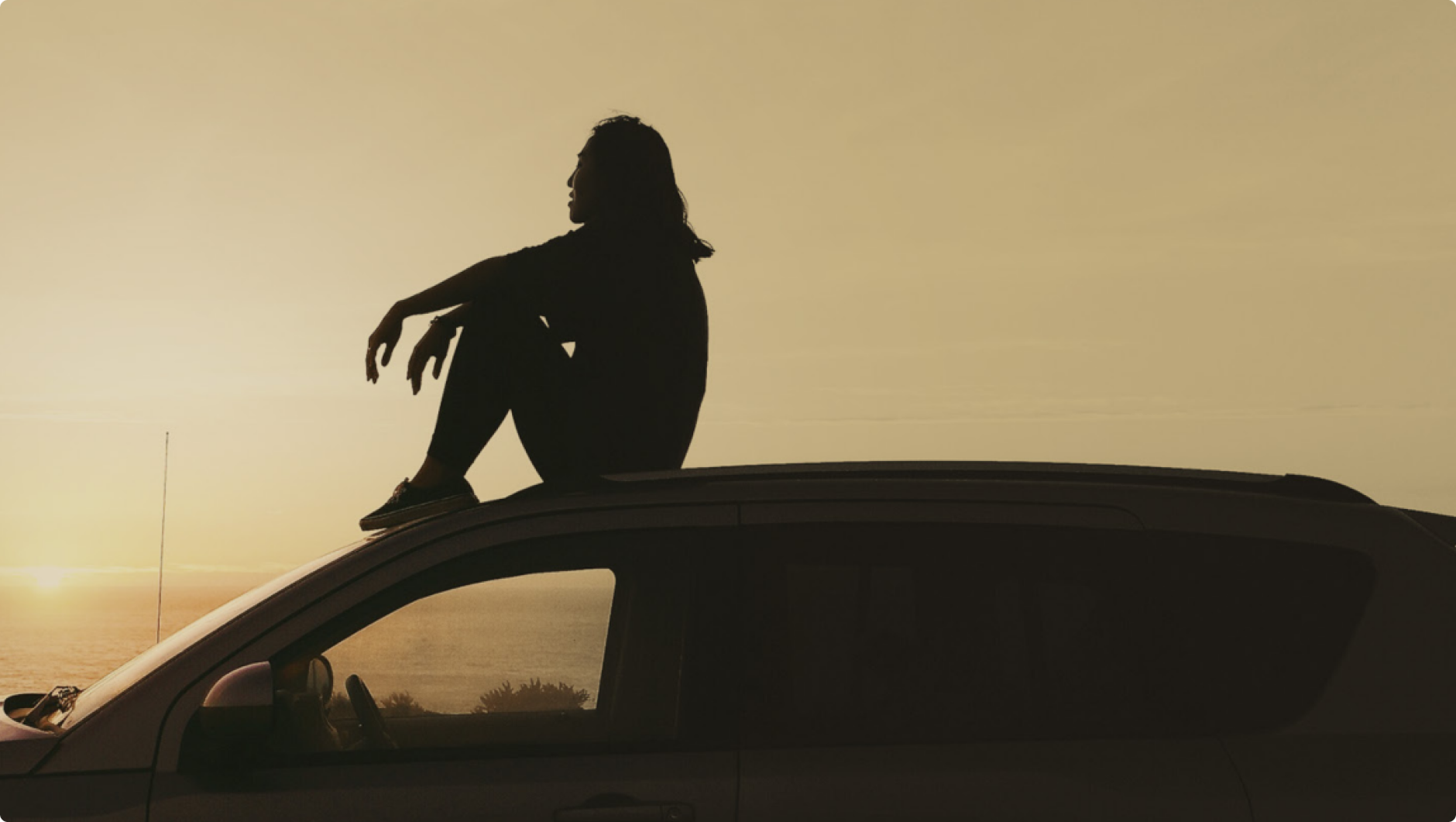 man sat on car