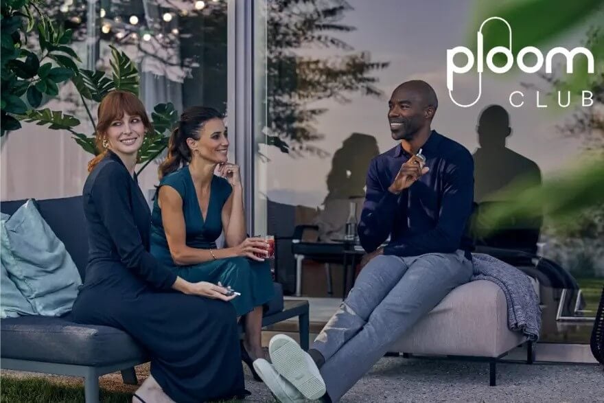 Three people using Ploom devices at Ploom Club